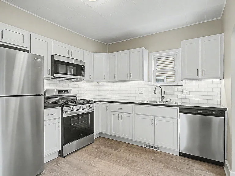 All new kitche with stainless appliances and soft close shaker cabinetry