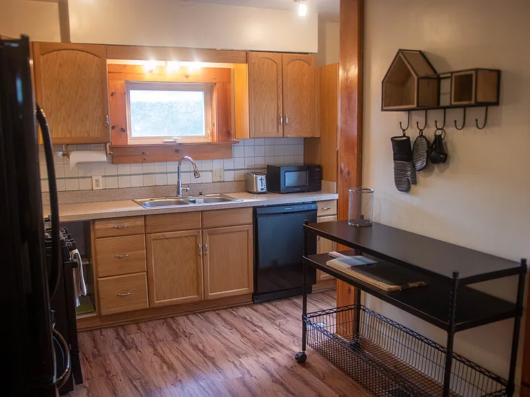 Spacious kitchen with entry to backyard and driveway.