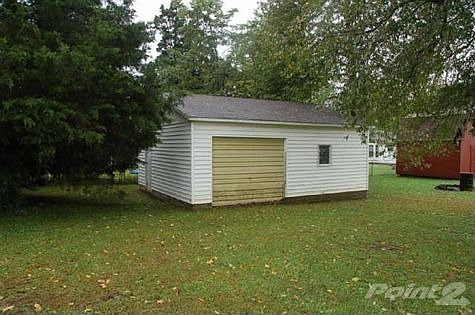 Great mature trees, and nice space between the house and garage/workshop.