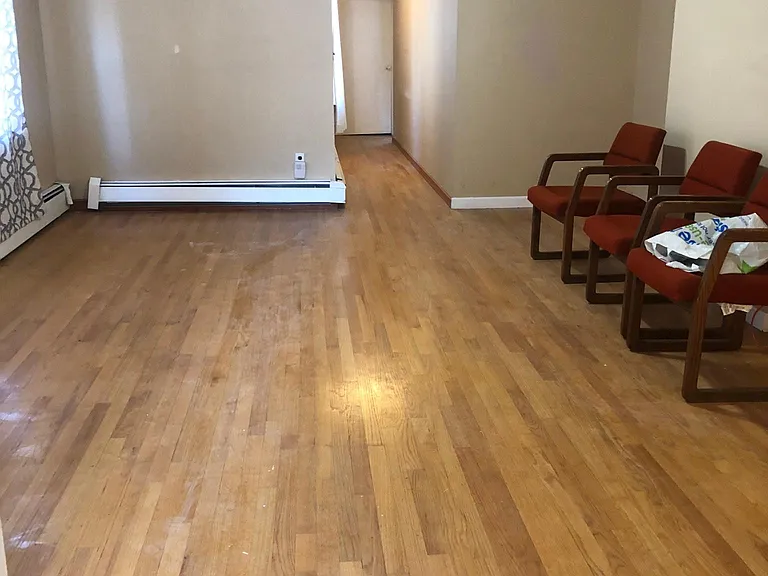 Large living room area. Hallway goes to master bedroom and kitchen.