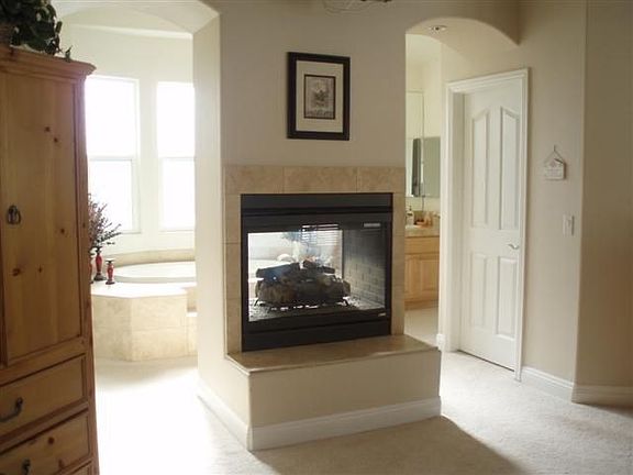 Master Suite with Sitting Area, double walk in closets, 2 sided Fireplace 