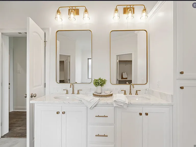 features a double vanity, providing plenty of space and convenience for two.