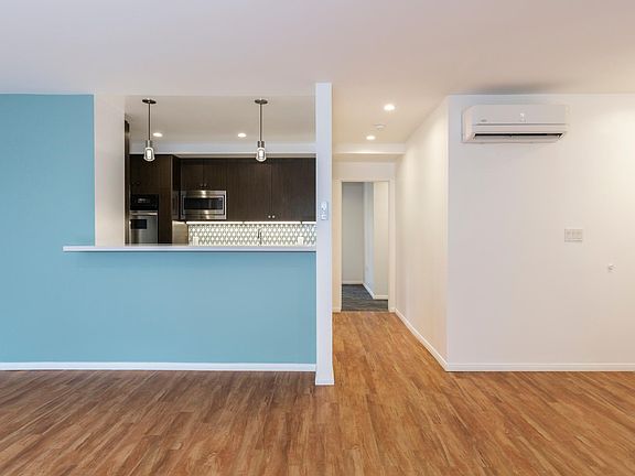 Open concept kitchen living area with built in bar