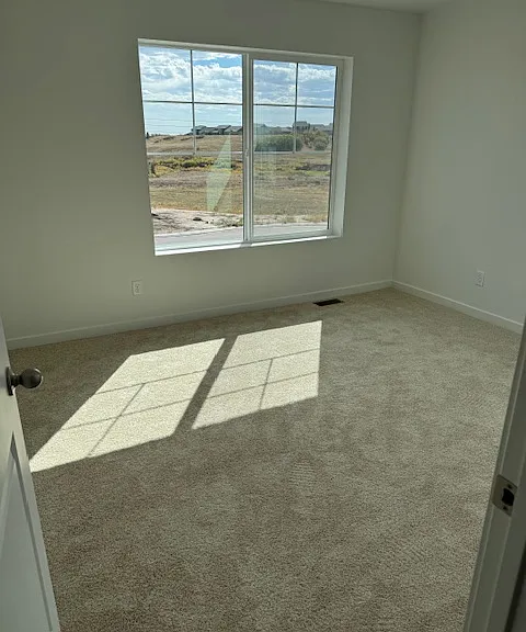 Third bedroom with large window