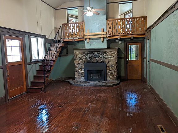 Large (2) story parlor room with natural gas fireplace insert