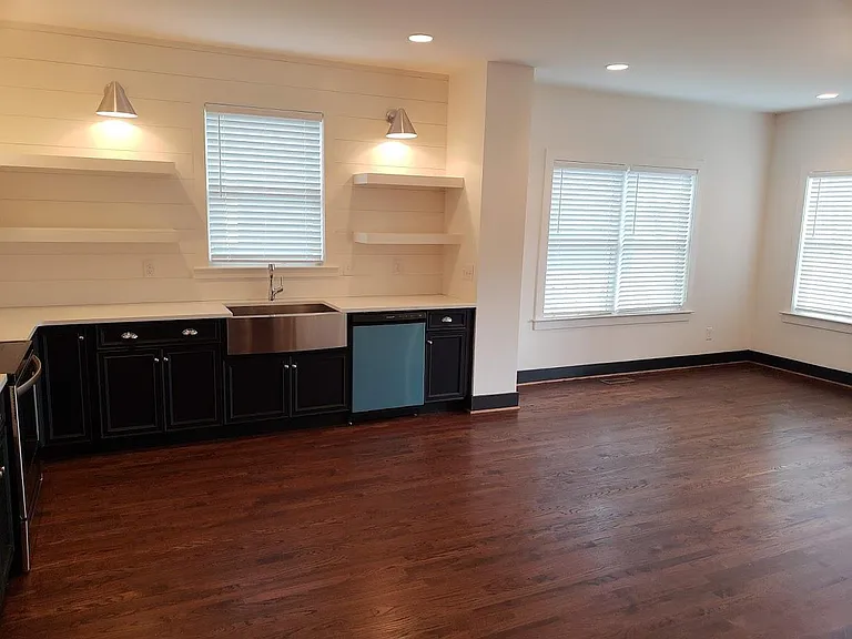 View of kitchen & corner of living room from entry hallway.