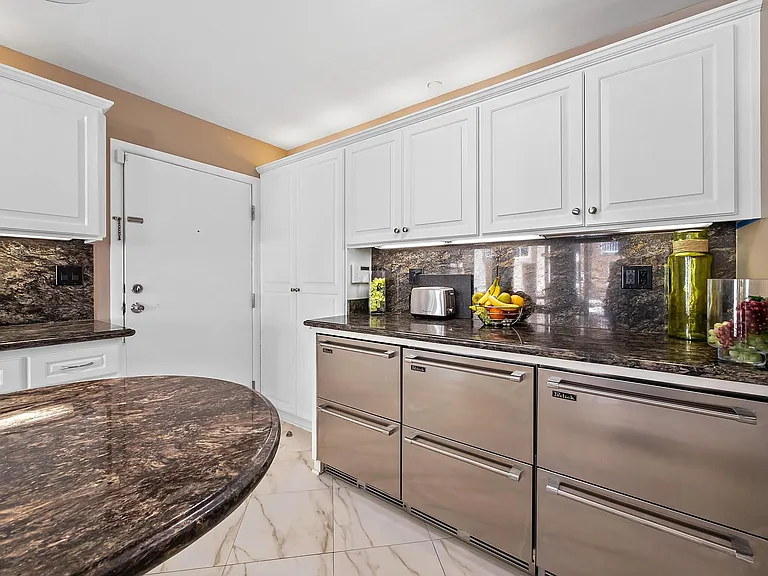 kitchen showing undercounter pullout refrigerator drawers and freezer