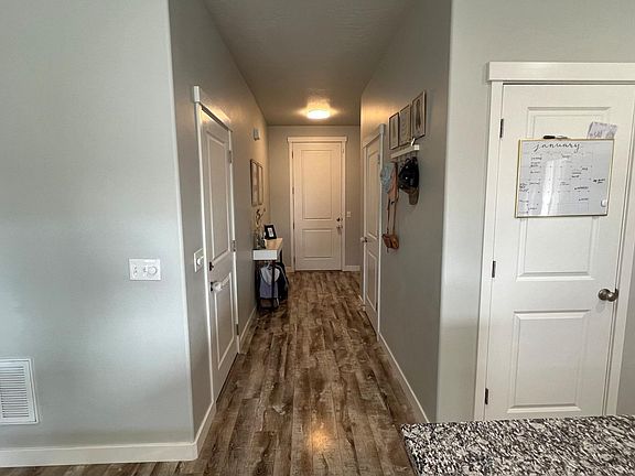 Entry to Kitchen. Garage door (Left). Coat Closet (Right). Pantry (Far Right)