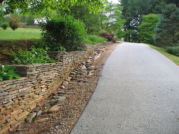 ROCK WORK LINING THE DRIVE