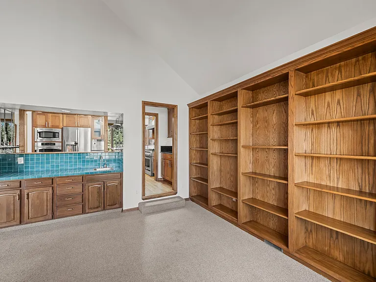 different view of study with wet bar
see through to kitchen