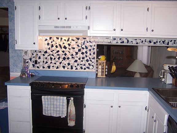 Updated kitchen with new smooth top stove and back splash