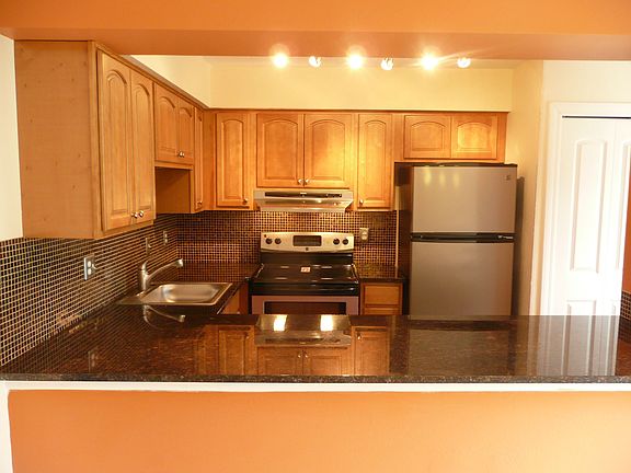 Granite counter tops, sink, faucets, and hardware all finished in nickel.