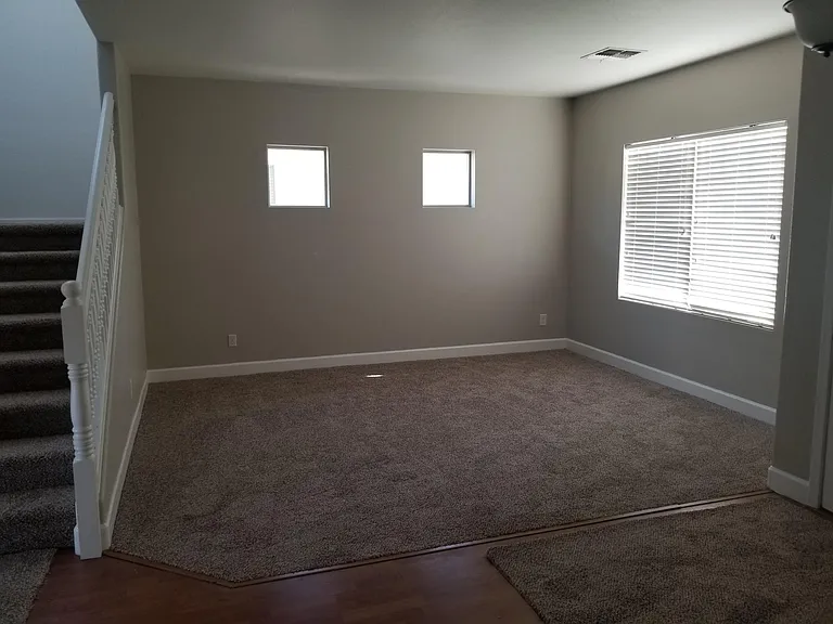 Formal living room. New carpet.