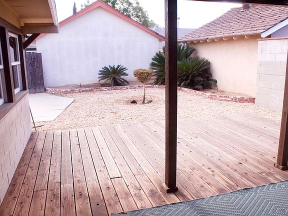 The backyard has a heightened porch, where you can sit and enjoy your morning coffee.