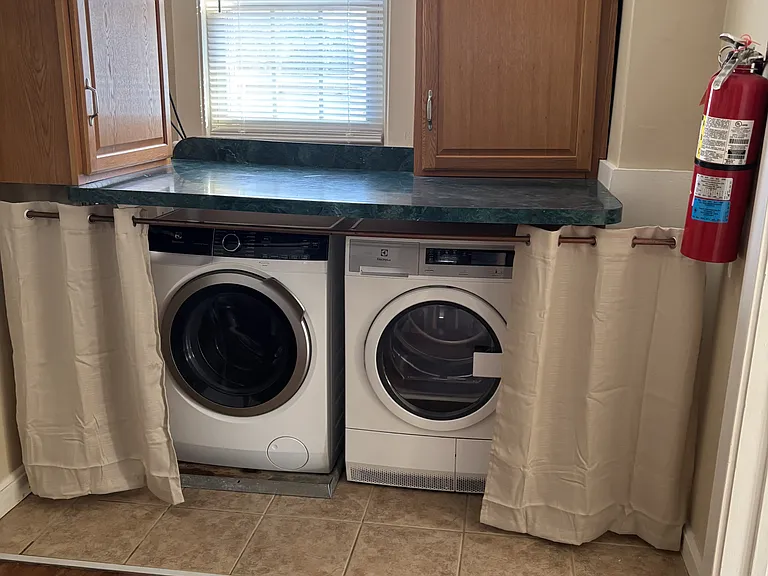 Washer & Dryer installed in unit.
