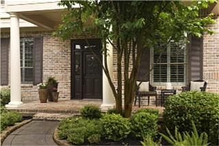 The brick covered front porch lends itself to visiting with neighbors or watching the children play 