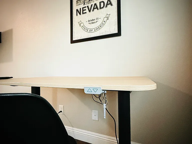 Adjustable height desk is a must. Sit or Stand!