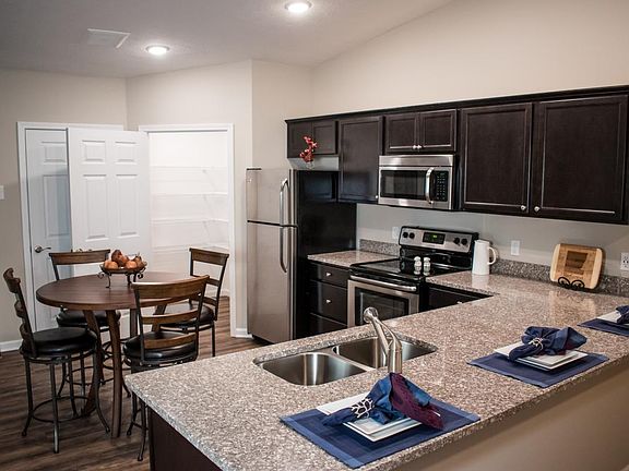 Room for your table and barstools with plenty of cabinetry,
