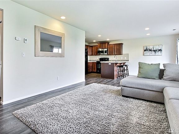 Living room flows to kitchen and dining area 