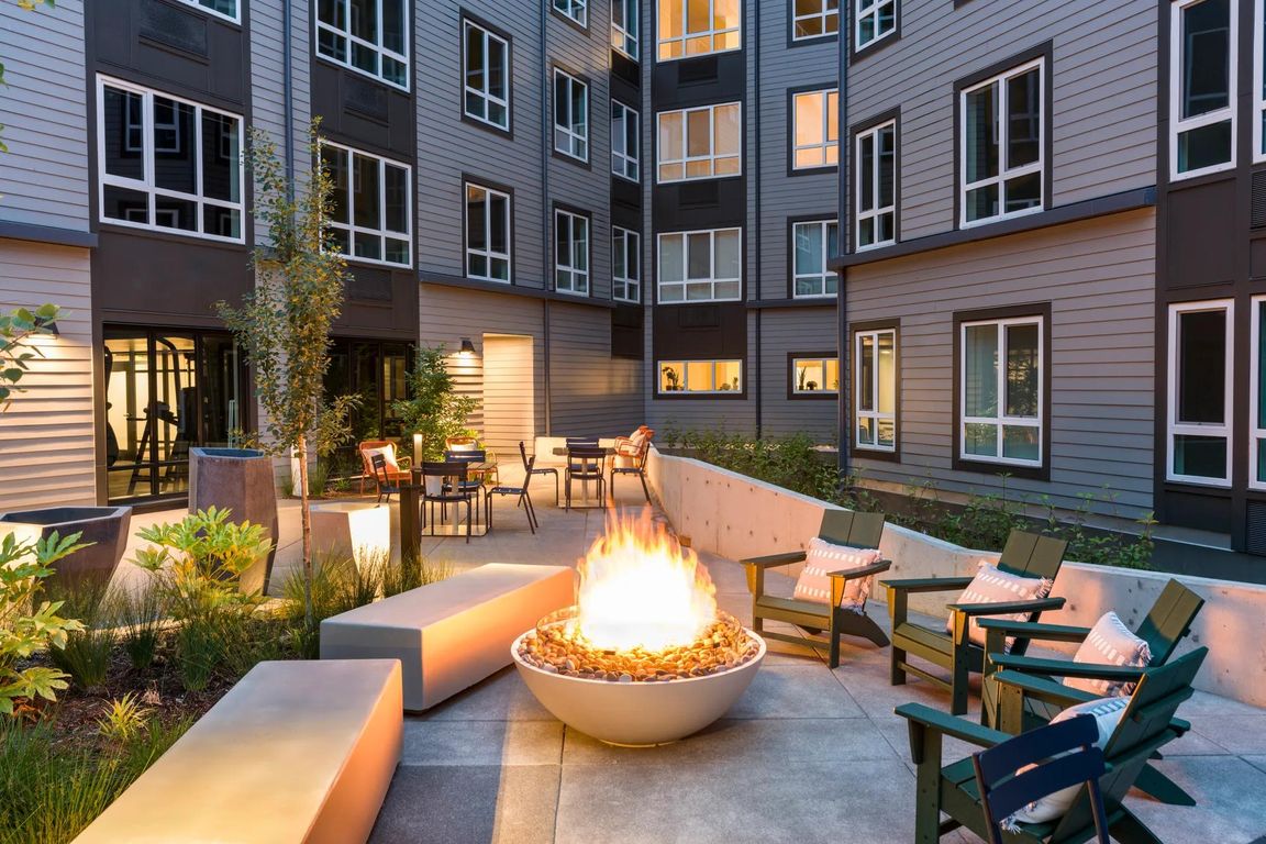 Gather around the inviting fire table on cool evenings or relax amidst vibrant greenery in ample comfortable seating.