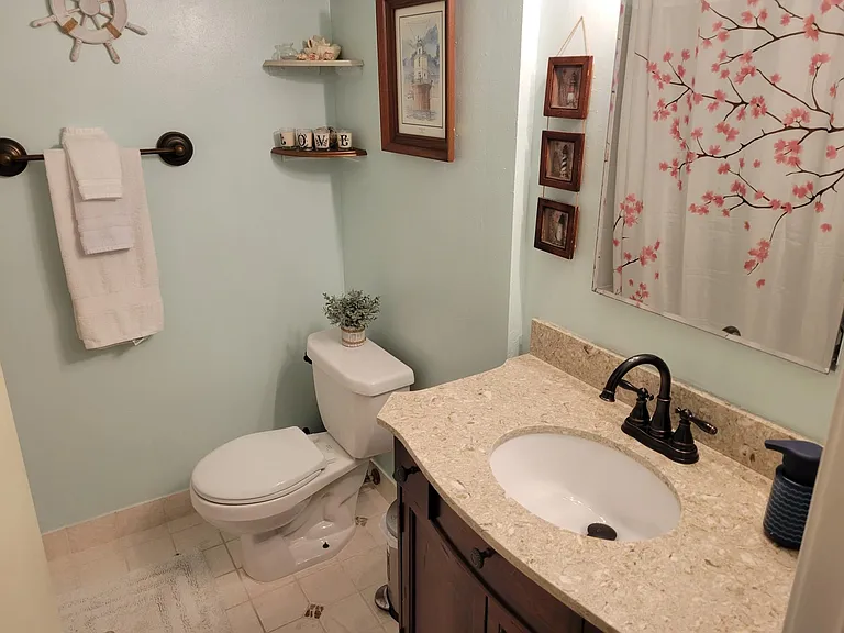 Hallway bathroom with bath tub.