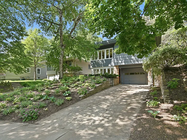 Front driveway and heated tuck-under garage for exclusive use by this unit