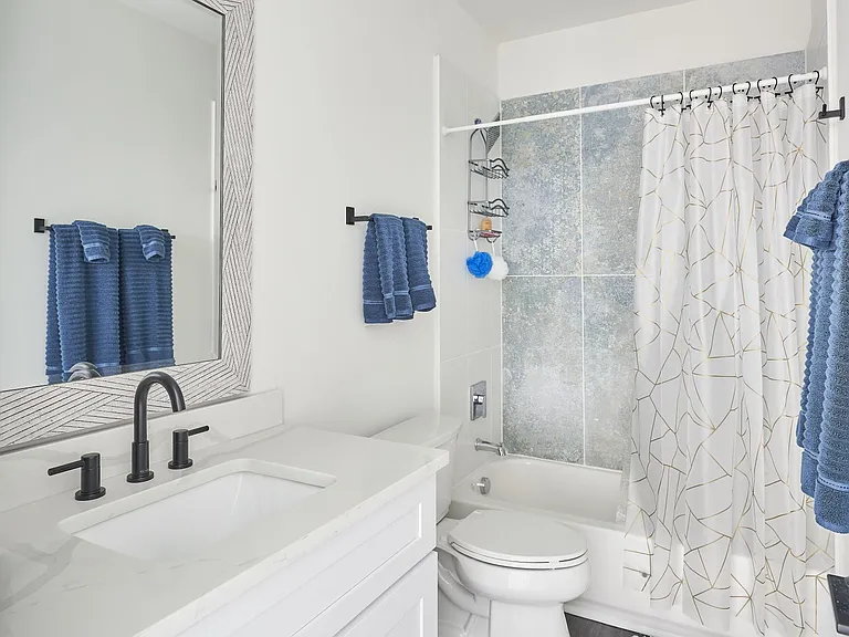 Bathroom with a funky tile, we love pattern