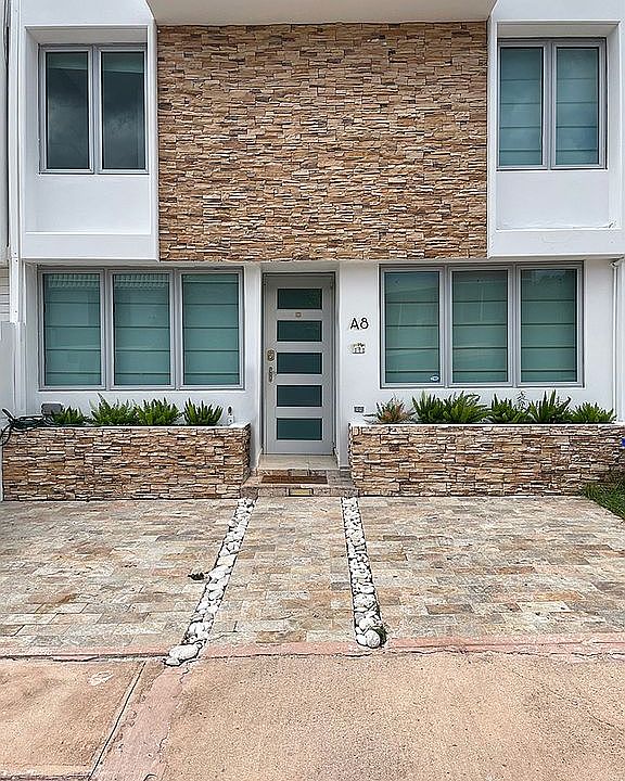 Front Door / 2- Car Driveway