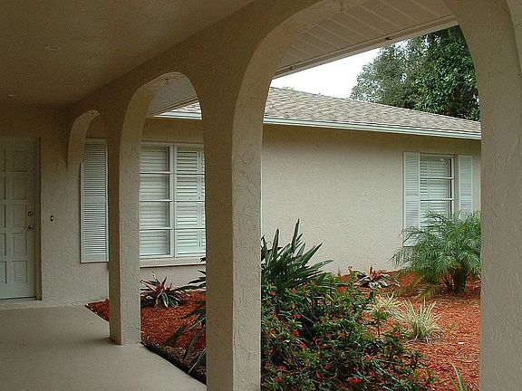 Covered spanish style front porch.
