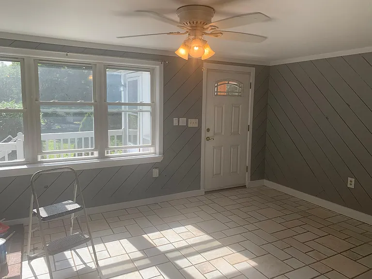 Dining area & front door (open, opposite of kitchen).