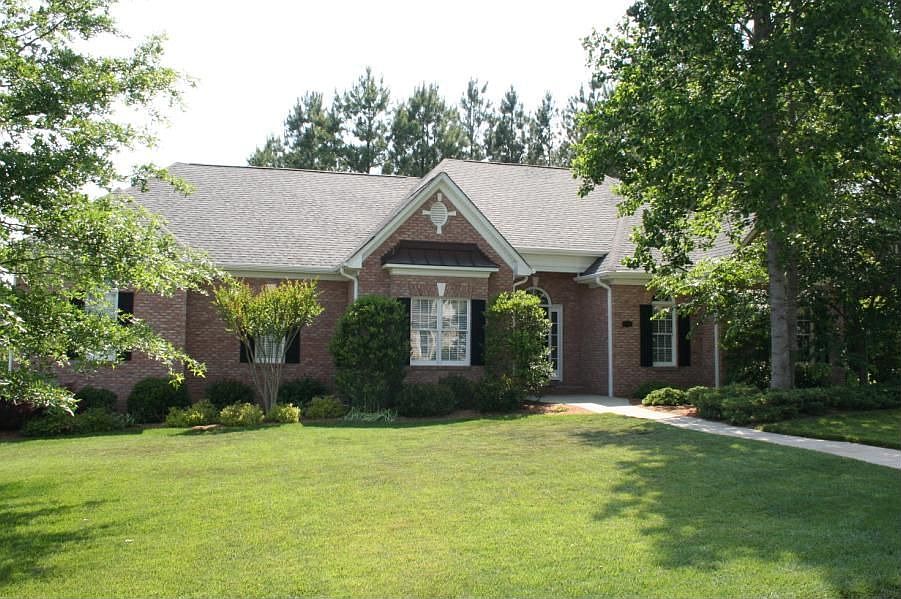 Lovely full brick, one story home set on a spacious, shaded, corner lot.