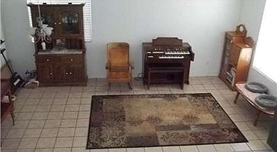 Living room with lots of natural light as well as louvered blinds between this room and lovely family room with fireplace.  Vaulted ceilings and handsomely tiles flooring  make the most of the 'Open' feeling in this floorplan!