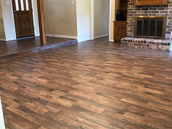 Living room shown with main entrance door.