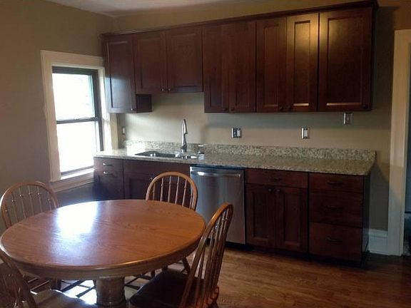 Kitchen (~14 x 14) - Cherry cabinets, granite counter tops, and stainless steel appliances .
