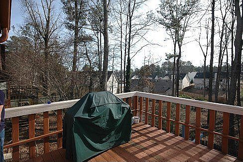 The backyard is fenced-in with a 2 level deck