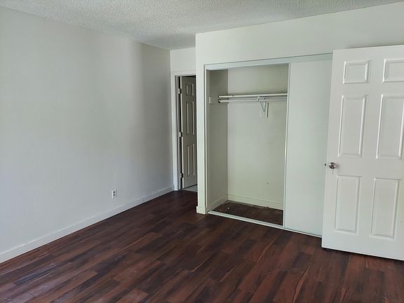 Master Bedroom with new closet doors, new flooring, new entry door and new paint job.