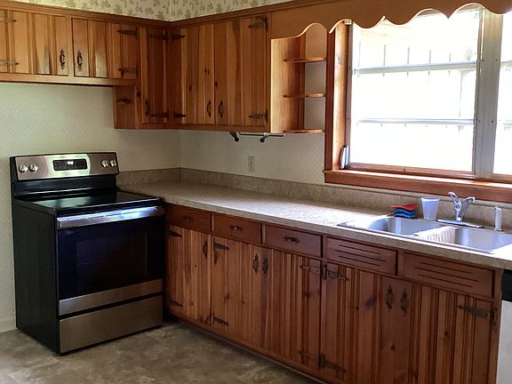 Kitchen. Stove, refrigerator, dishwasher provided. New countertops and vinyl flooring.