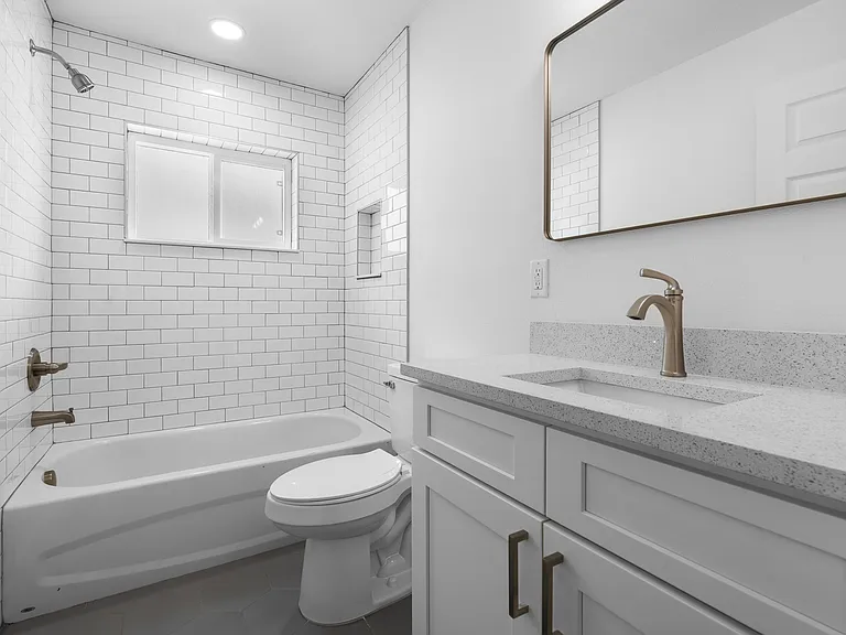 bathroom with tub and shower