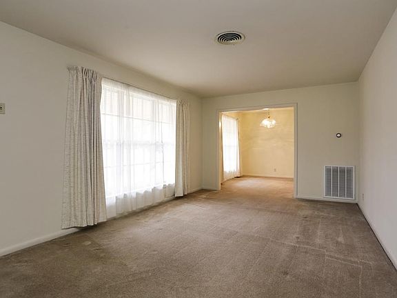 Upon entering the home, you'll find yourself in the spacious formal living room. This home has had t