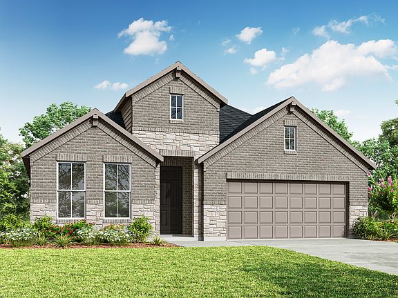 A two-story gray house with a garage, surrounded by lush greenery and a clear blue sky with fluffy w