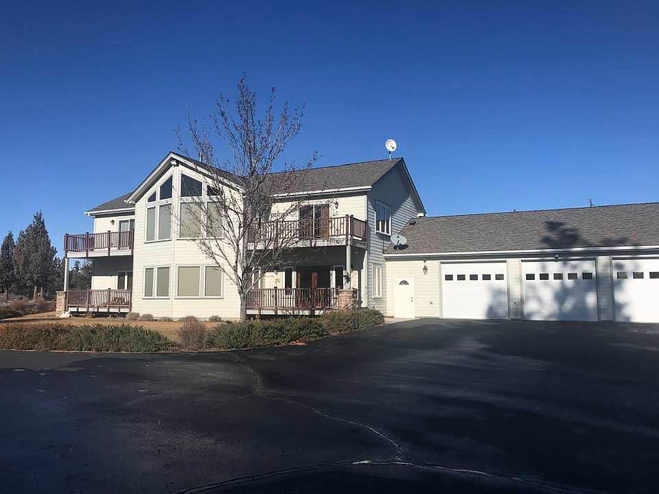 South side of home. Master is upper left. Living room is lower left. Dining is lower right- kitchen is back of lower right. Loft is upper right- murphy bed is back of upper right.