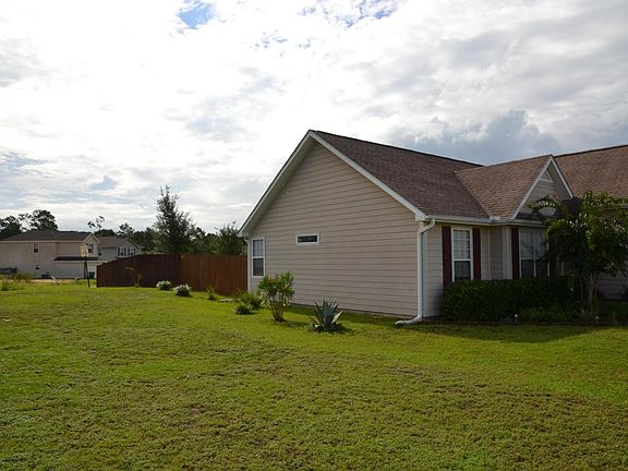 Side yard, with park just over the darker fence.