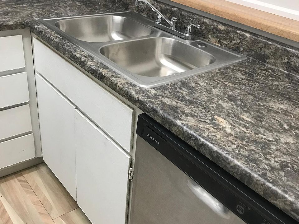 Kitchen with brand new counter, sink and dishwasher!