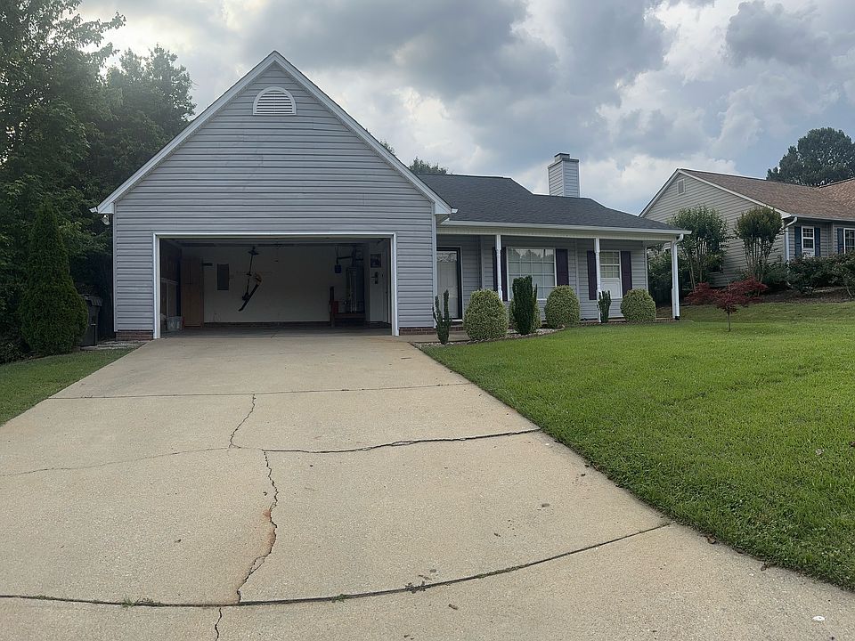 Front of home, driveway with ample space for parking, 2 car garage