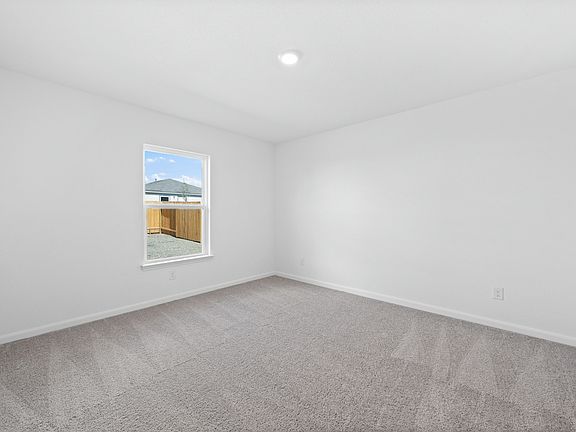 The master retreat includes its own bathroom and a walk-in closet