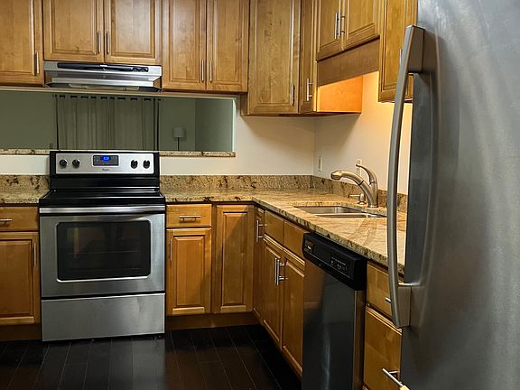Upgraded kitchen with granite, stainless appliances and bamboo flooring