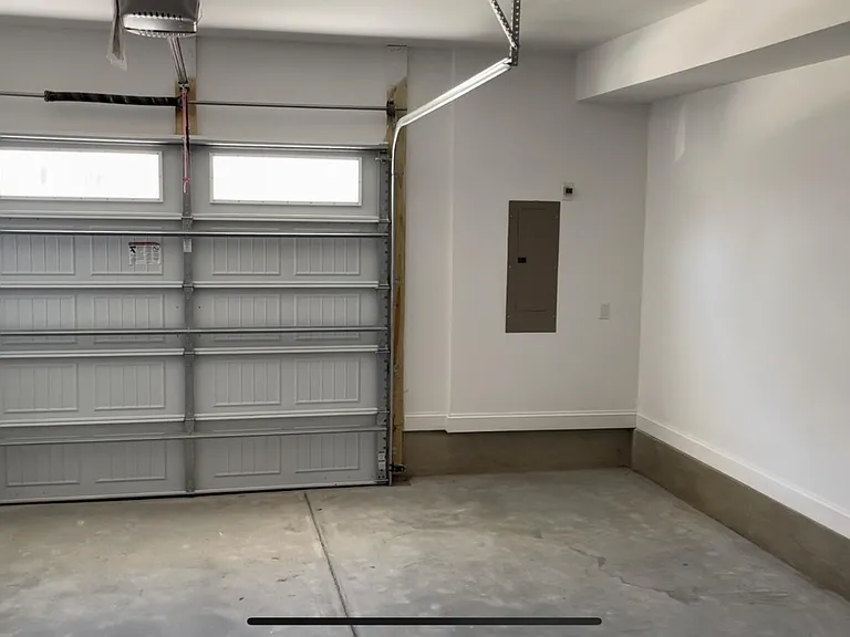 Spacious 1 car garage with plenty of room to also store a ATV / Motorcycle