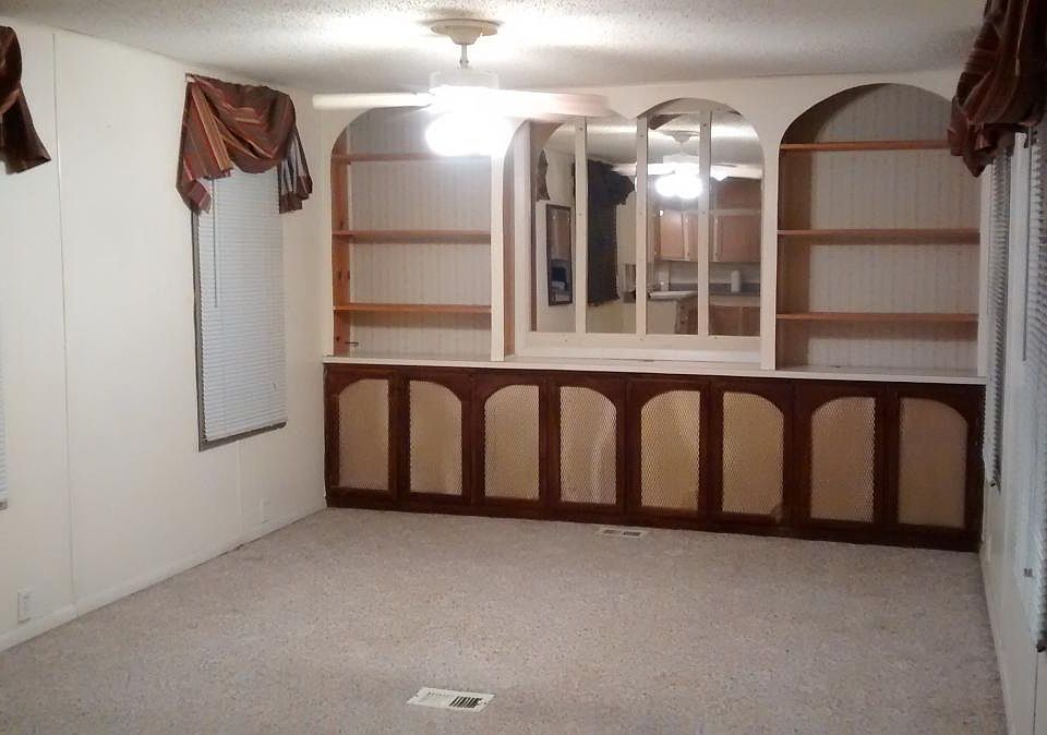 built in cabinets in the living room and lots of windows!