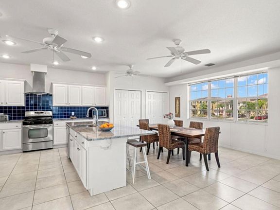open kitchen with spacious dining area and table