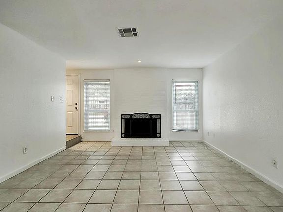 View of fireplace in the living area, create your own cozy space!